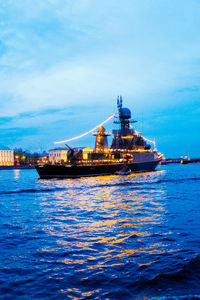 Calm sea with buildings in background