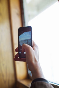 Close-up of hand using mobile phone