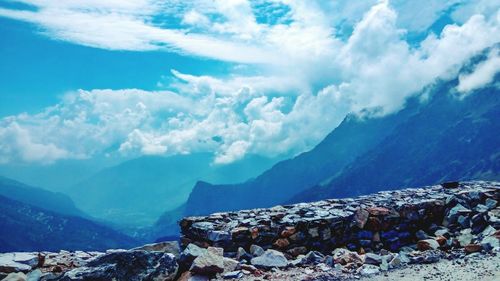 Scenic view of mountains against blue sky