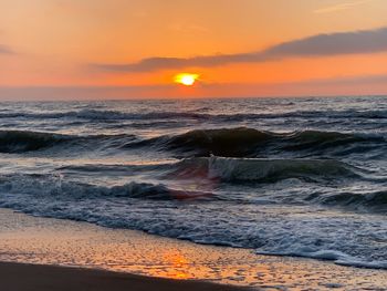 Scenic view of sea against sky during sunset