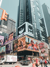 Low angle view of modern buildings against city