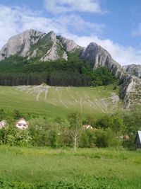 Scenic view of landscape and mountains against sky