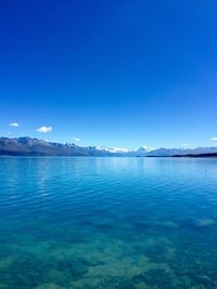 Scenic view of sea against blue sky