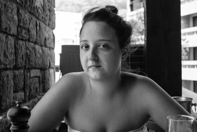 Portrait of young woman sitting in cafe