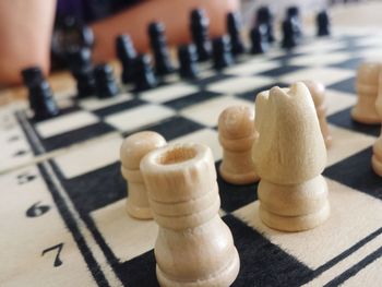 Close-up of chess pieces on table