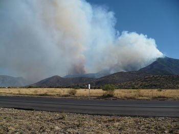 Scenic view of mountains against cloudy sky