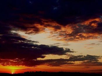 Scenic view of dramatic sky during sunset