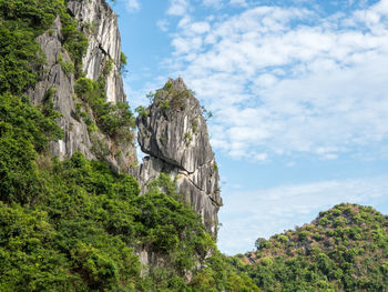 Low angle view of rock formations against sky