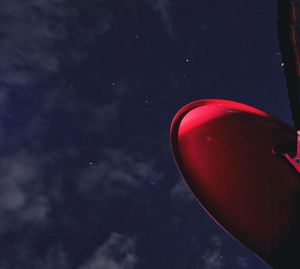 Red light against sky at night