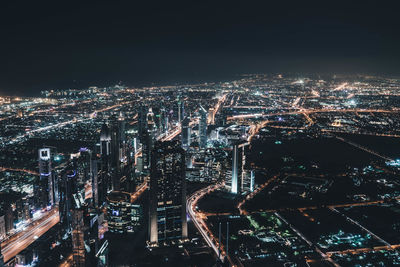 Aerial view of illuminated city at night