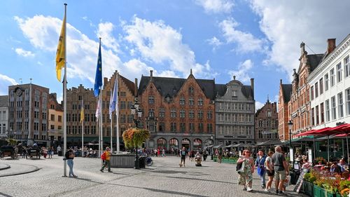 People walking on street in city