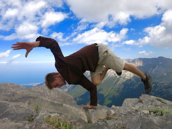 Low angle view of people against sky