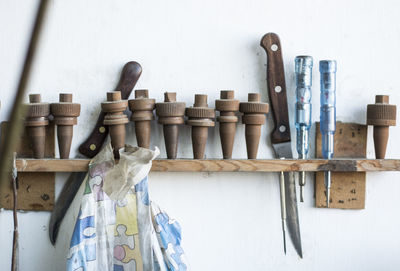 Clothes drying on table against wall