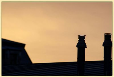 Low angle view of building at sunset