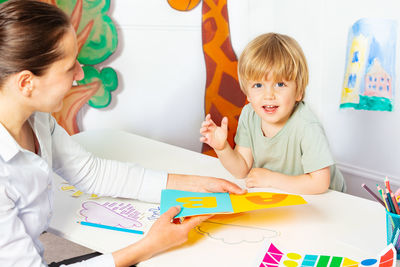 Portrait of boy working at home