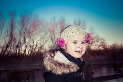 Portrait of a girl smiling outdoors