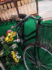 Close-up of flowering plant by bicycle