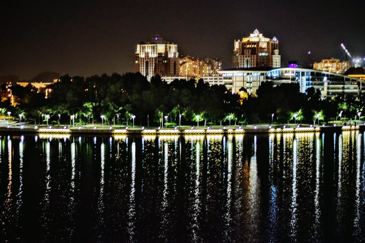 water, architecture, building exterior, built structure, night, reflection, waterfront, illuminated, river, lake, city, sky, outdoors, no people, clear sky, tree, residential building, nature, rippled, building