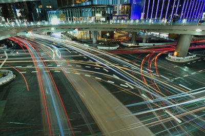 High angle view of light trails on road at night