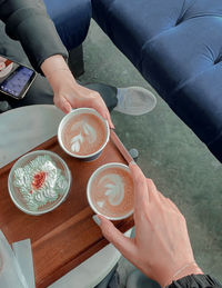 High angle view of people holding drink