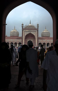 Group of people in front of mosque