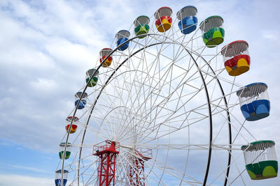 Low angle view of ferris wheel against sky