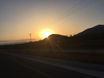 Empty road at sunset