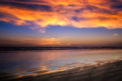 Scenic view of sea against orange sky