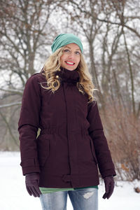 Portrait of a girl standing on snow