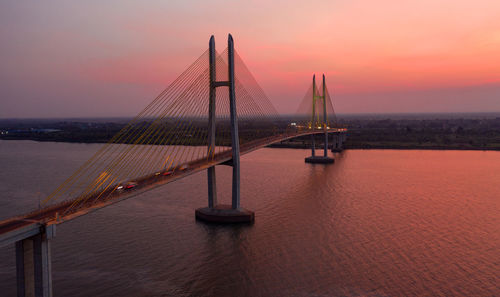 View of bridge over sea during sunset