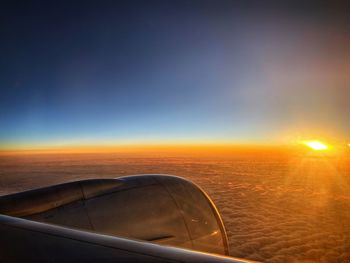 Scenic view of sunset seen through airplane window
