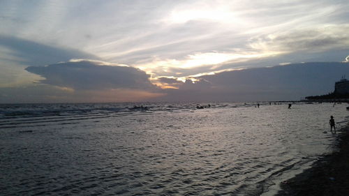 Scenic view of beach against sky during sunset