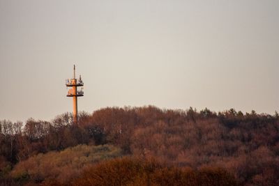 Tower on field against clear sky