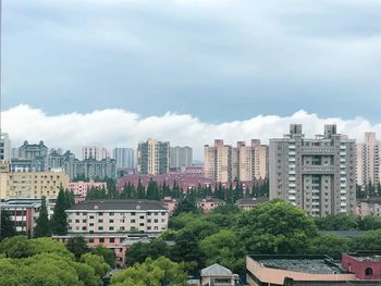 High angle view of buildings in city against sky