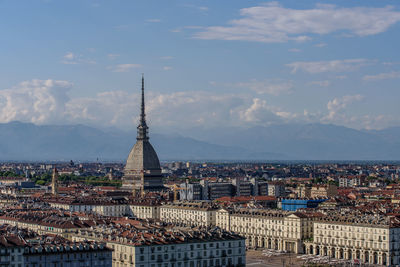 High angle view of city lit up against sky, turin, piedmont, italy