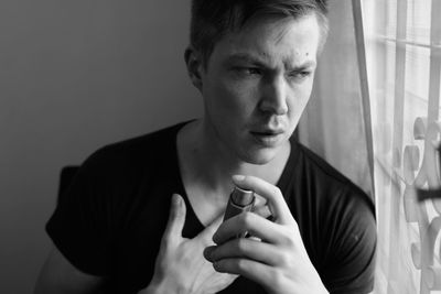 Portrait of young man looking away