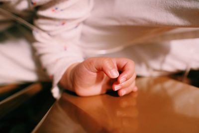 Close-up of hands holding baby hand