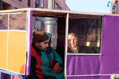 People sitting in glass window