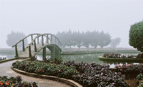 View of bridge over river against sky during winter