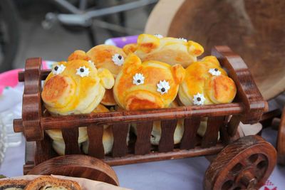 High angle view of bread rolls in wooden toy