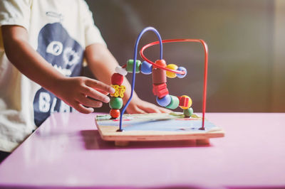 Midsection of boy playing with equipment