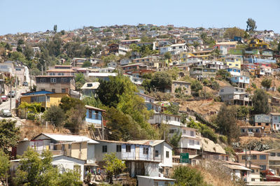 Houses in town against clear sky