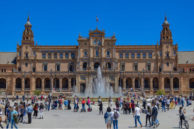 Group of people in front of historical building