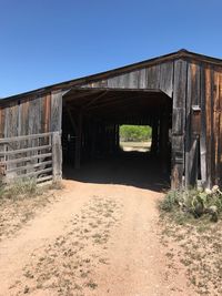 Old abandoned building against clear blue sky