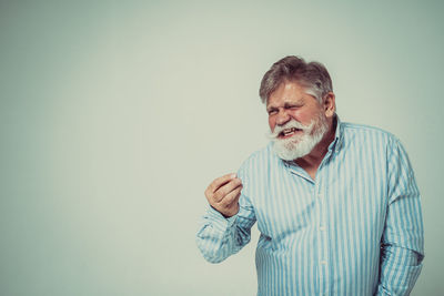 Man standing against wall