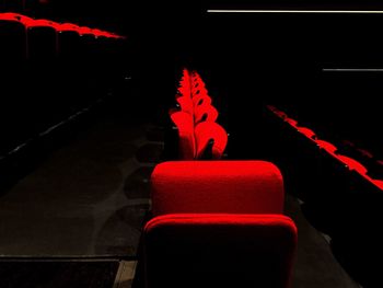 Red seat in illuminated room