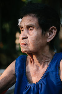 Woman with injured forehead outdoors