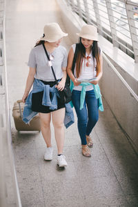 Tourists on footpath in city