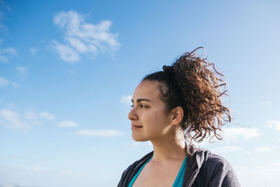 Woman smiling looking away from camera.