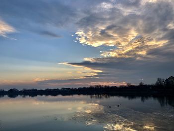 Scenic view of lake against sky during sunset